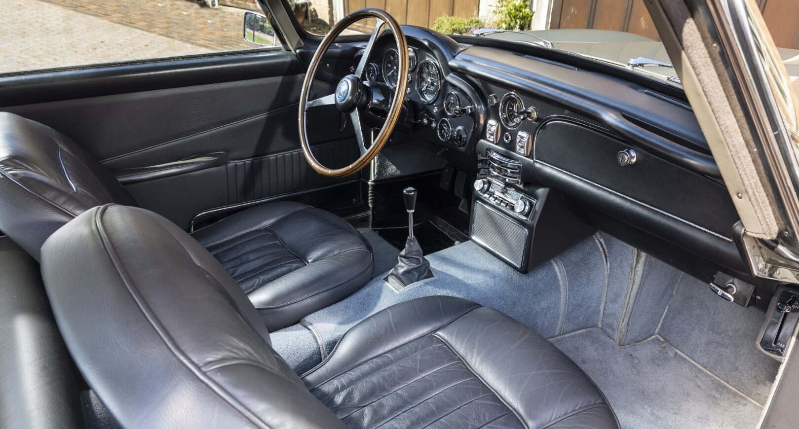 Front seats of silver Aston Martin DB5