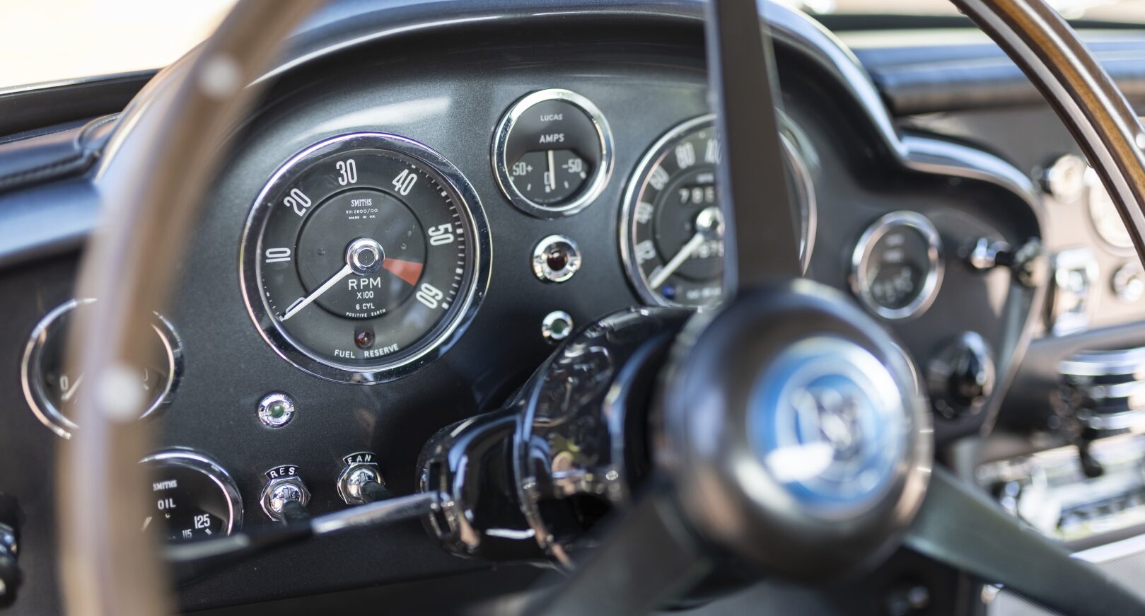 Steering wheel of silver Aston Martin DB5