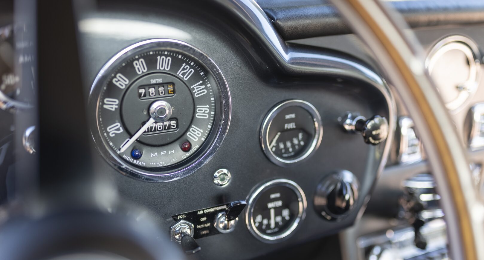 Dashboard of silver Aston Martin DB5
