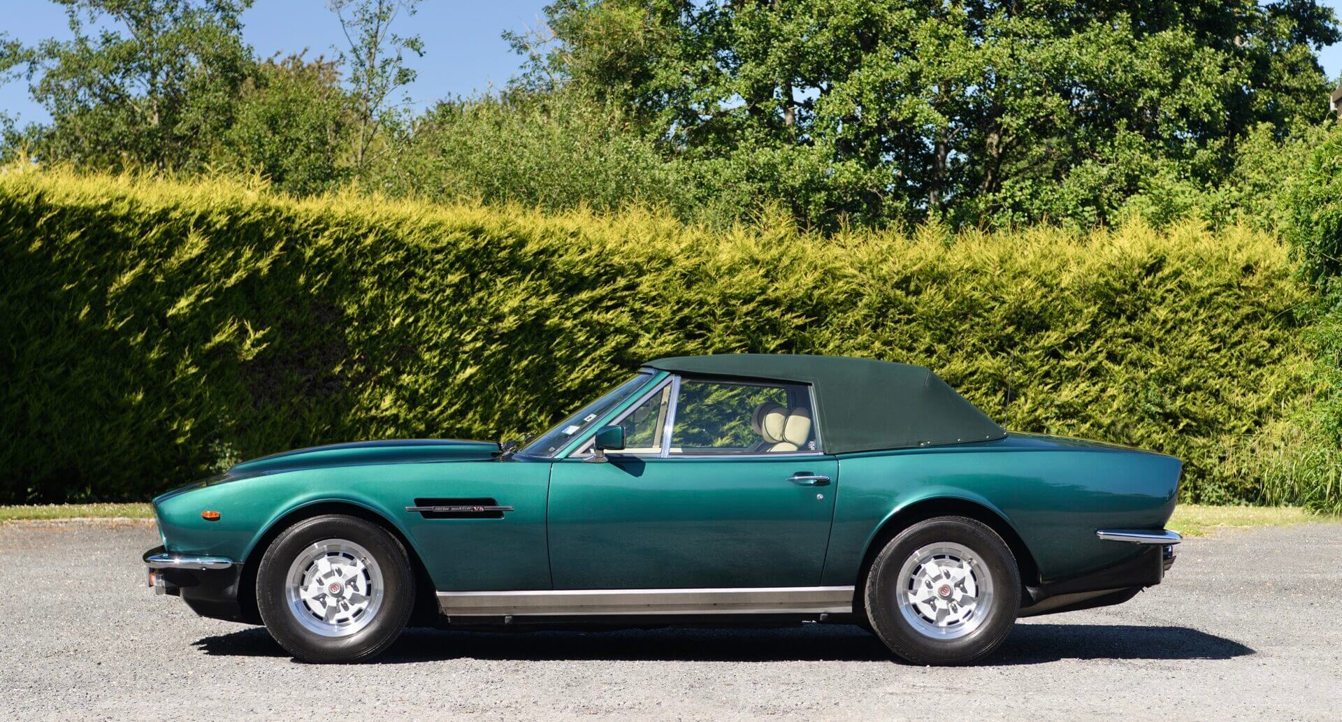 Left side view of Aston Martin V8 Volante with hood up
