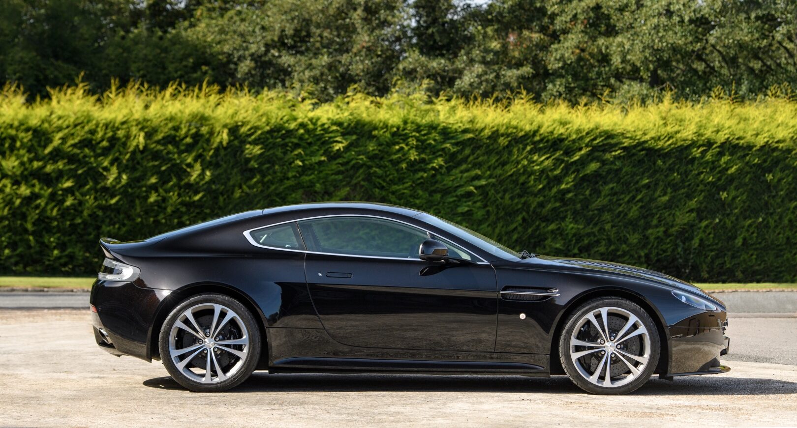 Side view of Storm Black Aston Martin V12 Vantage