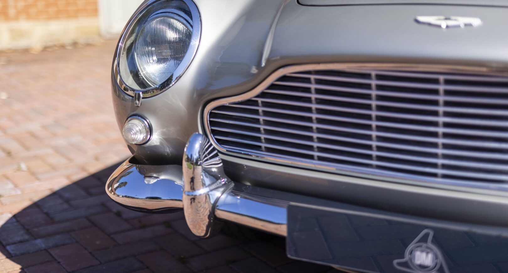 Front grill of silver Aston Martin DB5