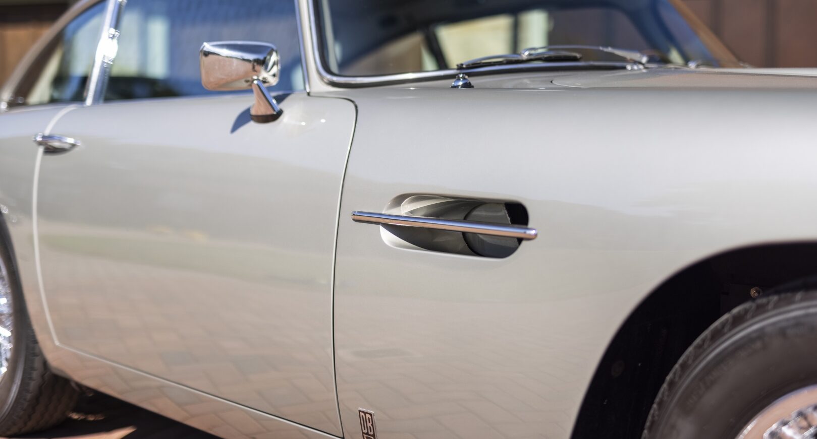 Front wing of silver Aston Martin DB5