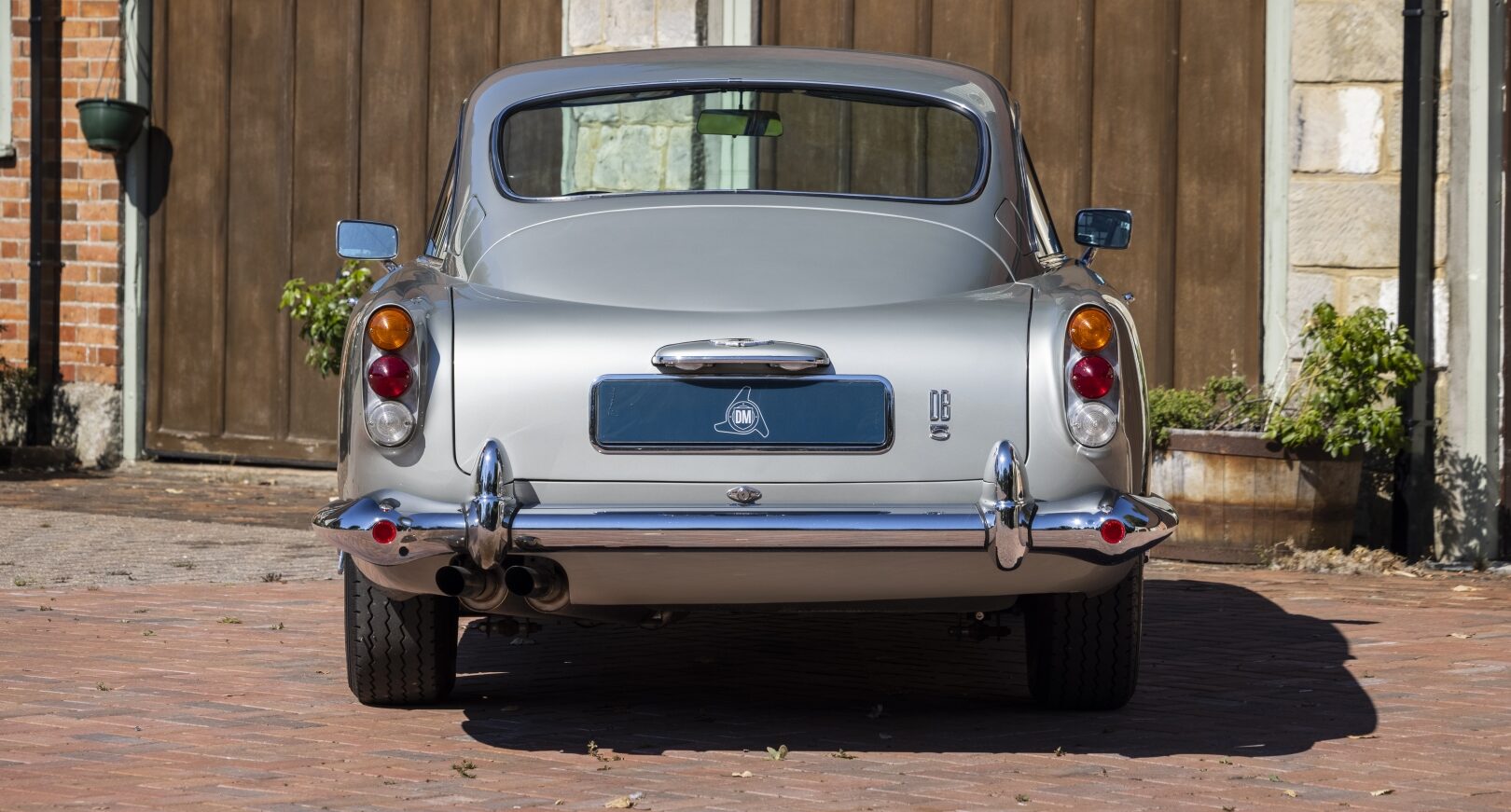 Rear view of silver Aston Martin DB5
