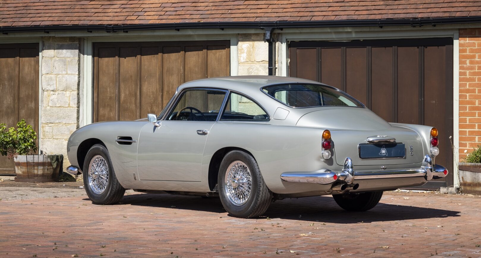 Photo of silver Aston Martin DB5 - rear three quarter view 