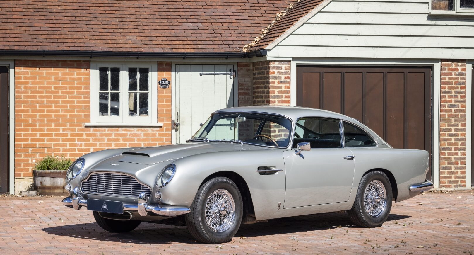 Photo of silver Aston Martin DB5