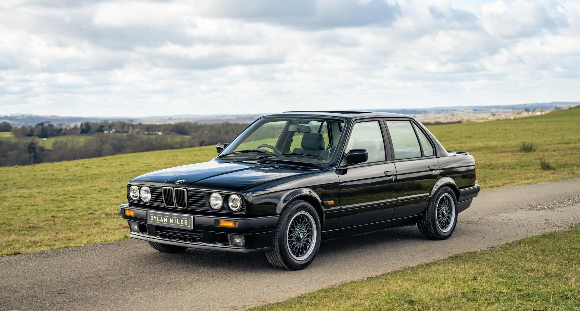 Side view of Black BMW E30 325i Saloon