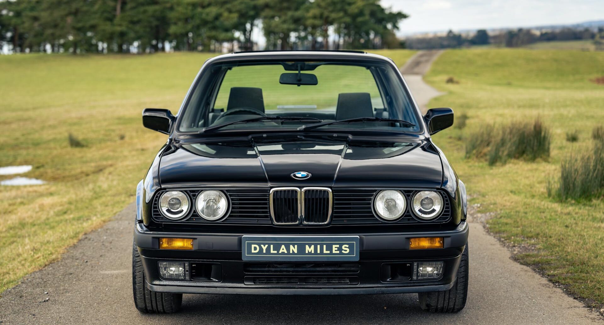 Front view of Black BMW E30 325i Saloon